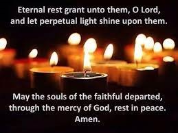 Prayer with lit candles in background: Eternal Rest grant unto them, O Lord, and let perpetual light shine upon them. May the souls of the faithful departed, through the mercy of  God, rest in peace. Amen.