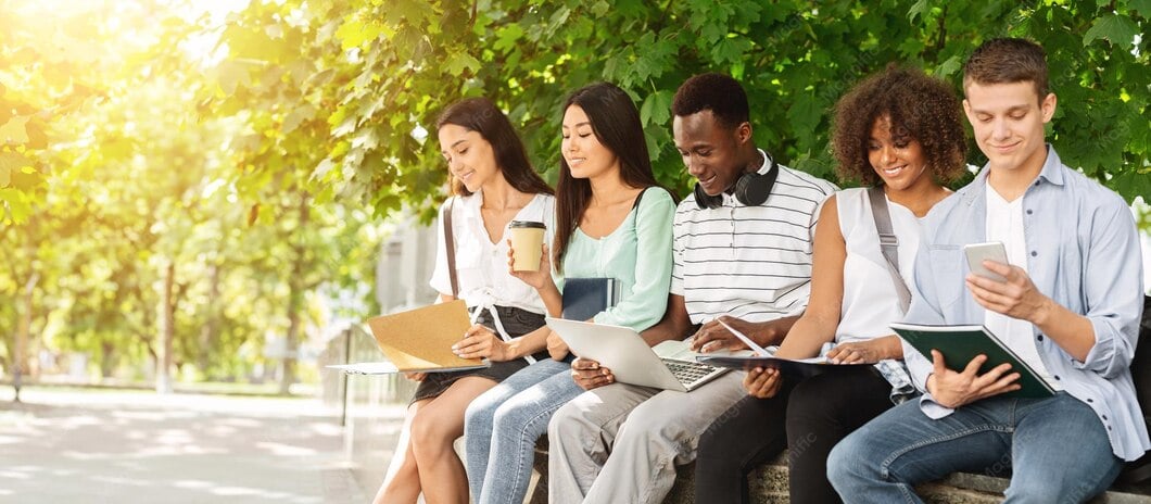 Students in Park - studying with books