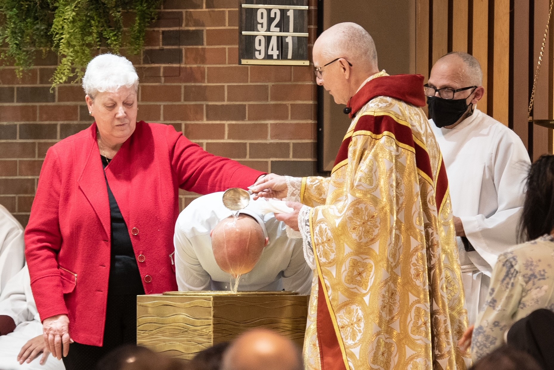Easter 2023 - Parishioner receiving baptism