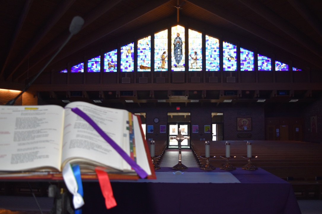 View of Church from Altar with Open Bible and Cross on Altar