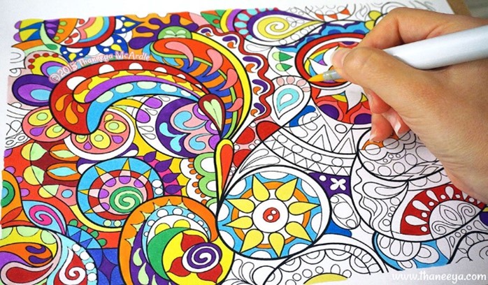 Colouring Paper - Person's Hand Colouring on Paper