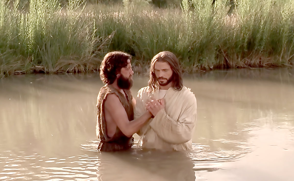 Jesus in the river with St. John - Holding each other
